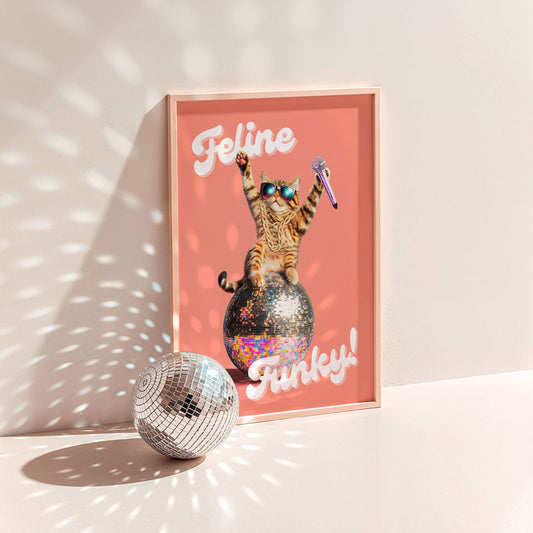 a picture of a cat sitting on top of a disco ball