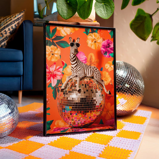 a picture of a zebra sitting on top of a disco ball