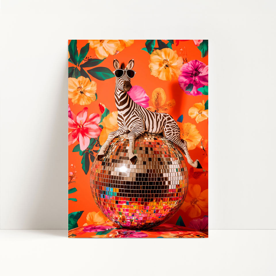 a zebra sitting on top of a disco ball