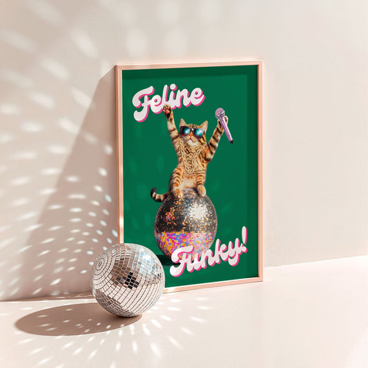 a picture of a cat sitting on top of a disco ball
