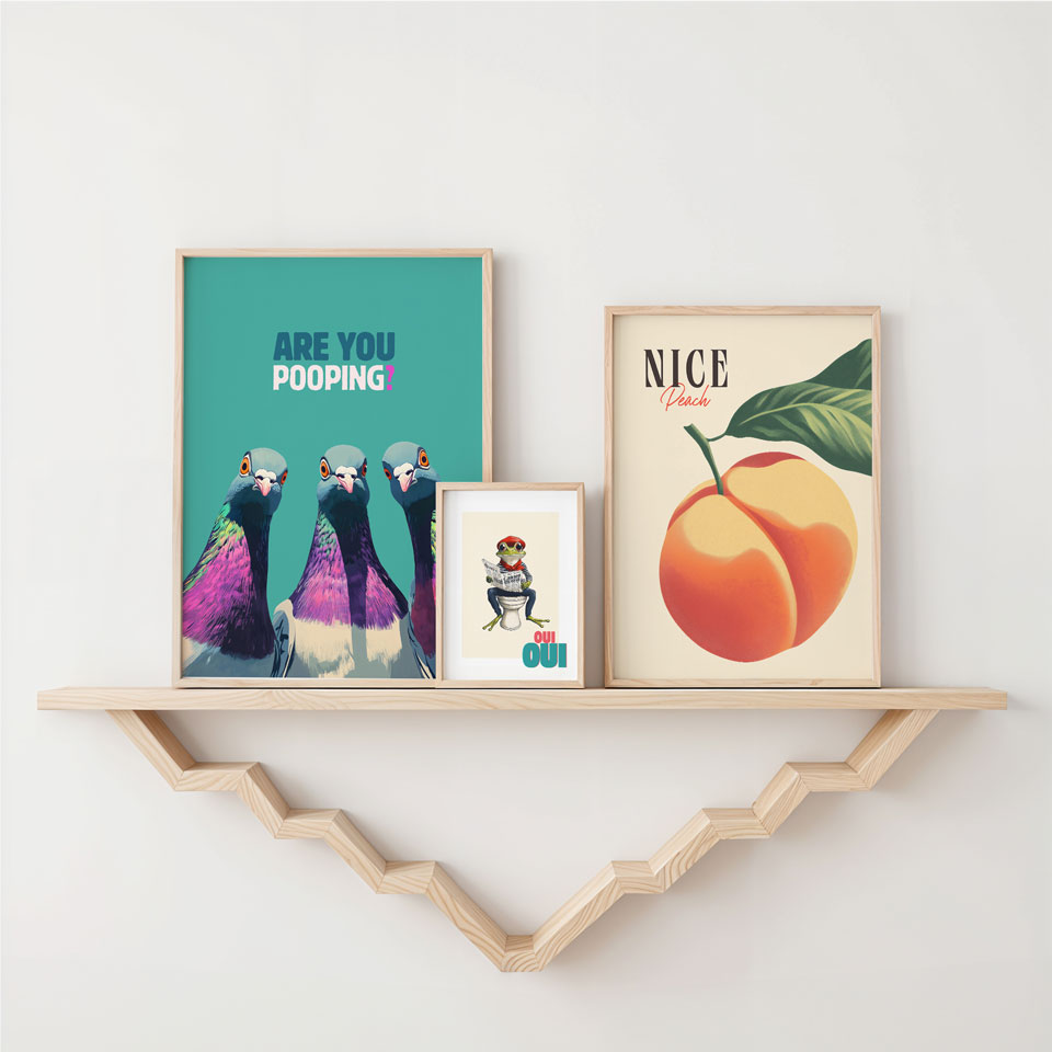a shelf with a couple of framed pictures on it