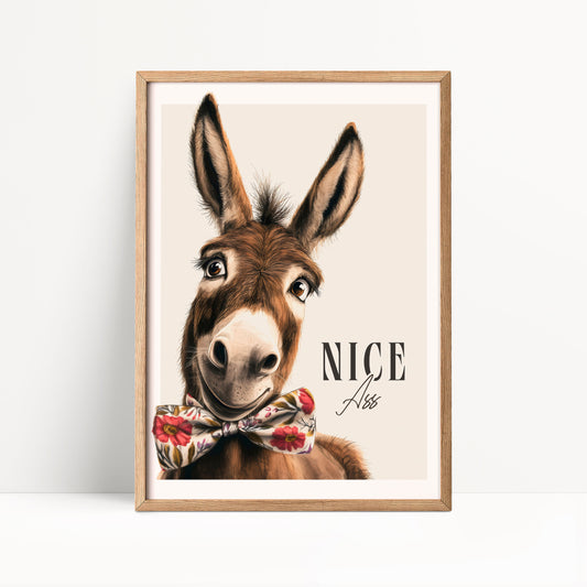 A donkey wearing a bow tie and smiling at the camera.