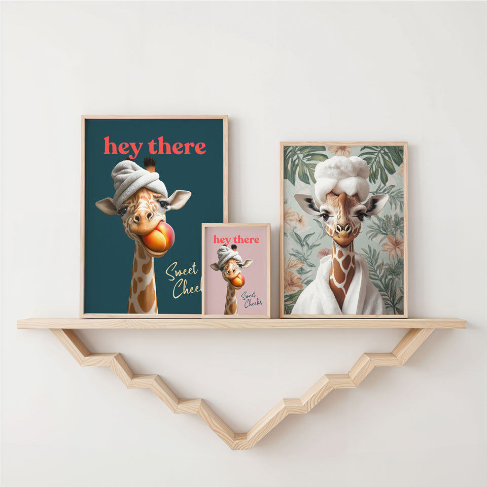 two giraffes on a shelf next to a picture of a giraf